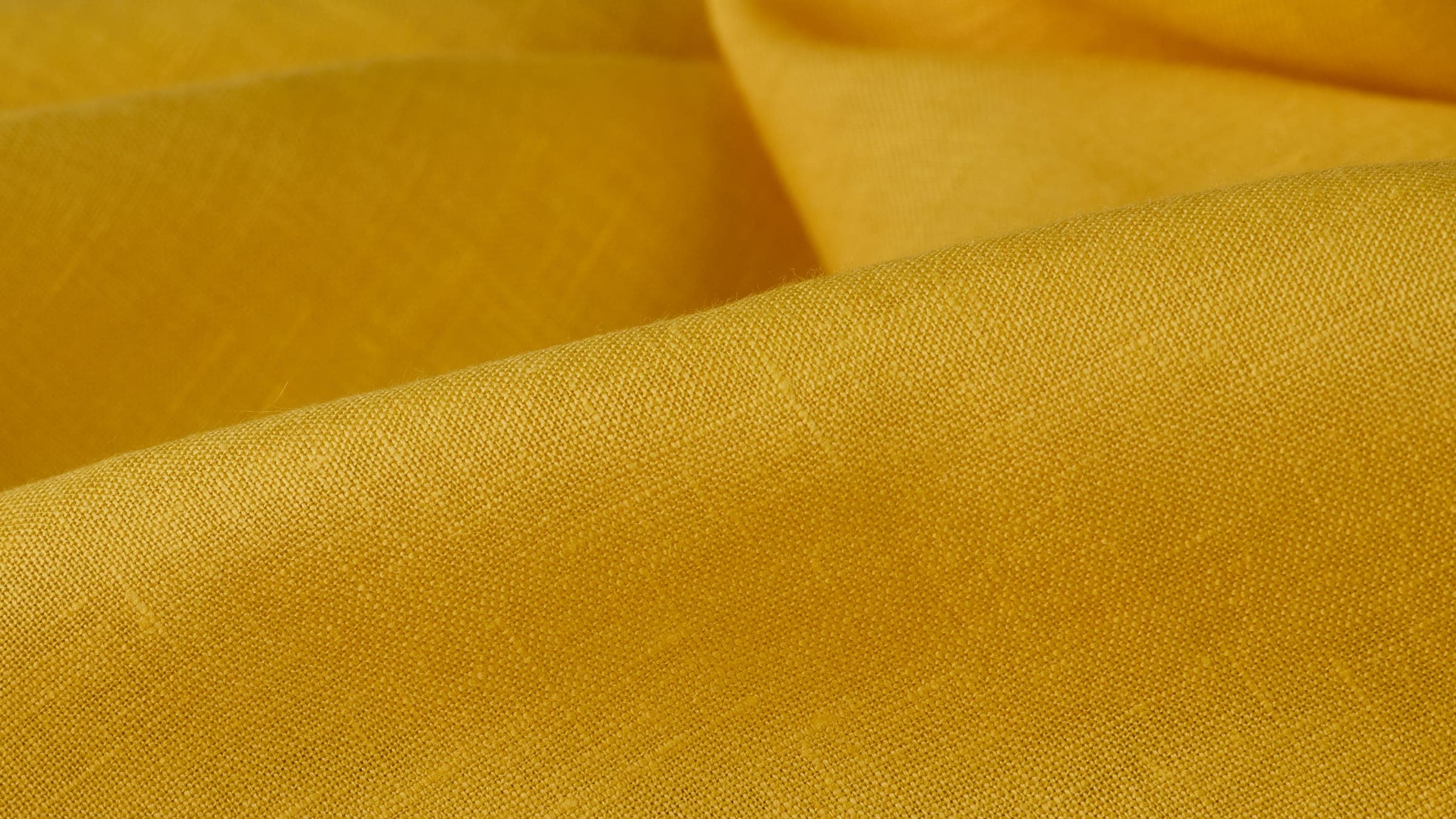 Mustard-yellow linen, draped in soft folds