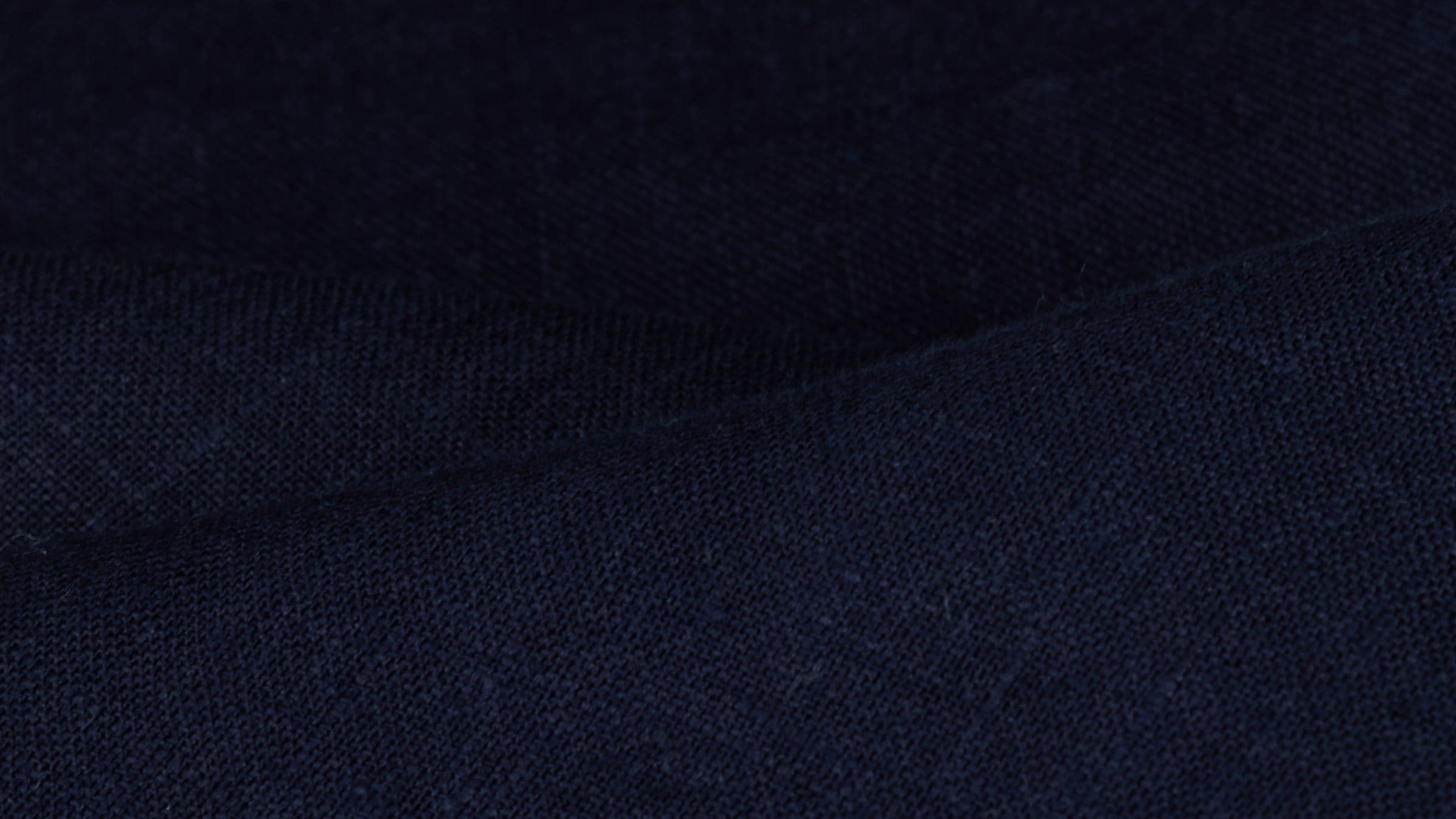 Navy linen in soft folds, close up